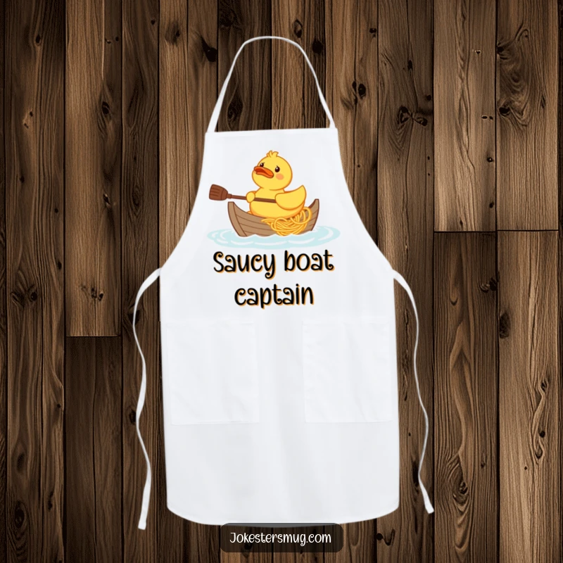 Funny confused rubber duck character trying to paddle a boat made of spaghetti, graphic on a cooking apron.