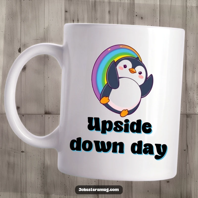 Funny mug featuring a penguin sliding down a rainbow and landing upside down with a comically surprised expression, full of whimsical delight.