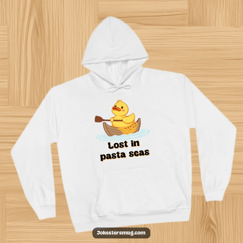 Funny confused rubber duck character trying to paddle a boat made of spaghetti, graphic on a cozy hoodie.