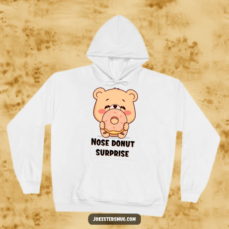 Funny cozy hoodie featuring a bewildered bear with a donut stuck on its nose, a warm humorous gift.