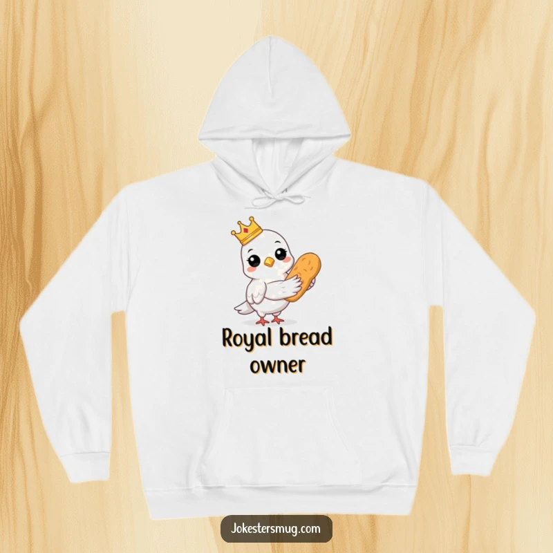 Funny cozy hoodie featuring a pigeon wearing a crown and holding bread, a warm regal gift.