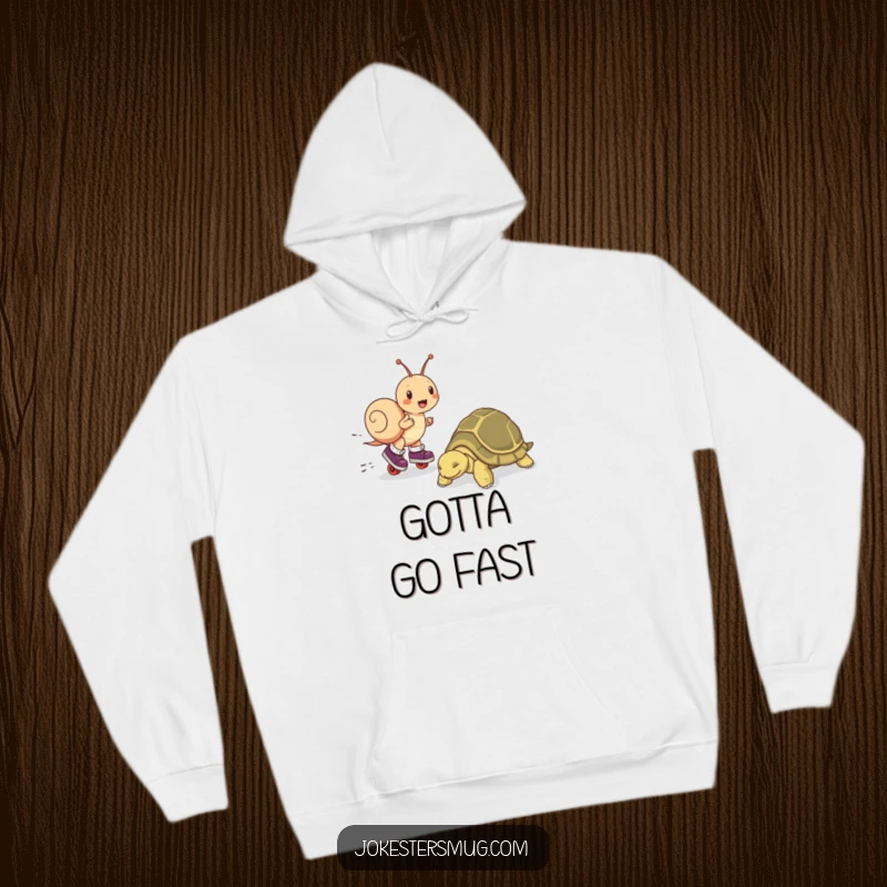 Funny hoodie featuring a snail on roller skates outracing a sleeping tortoise, perfect for cozying up with smiles.