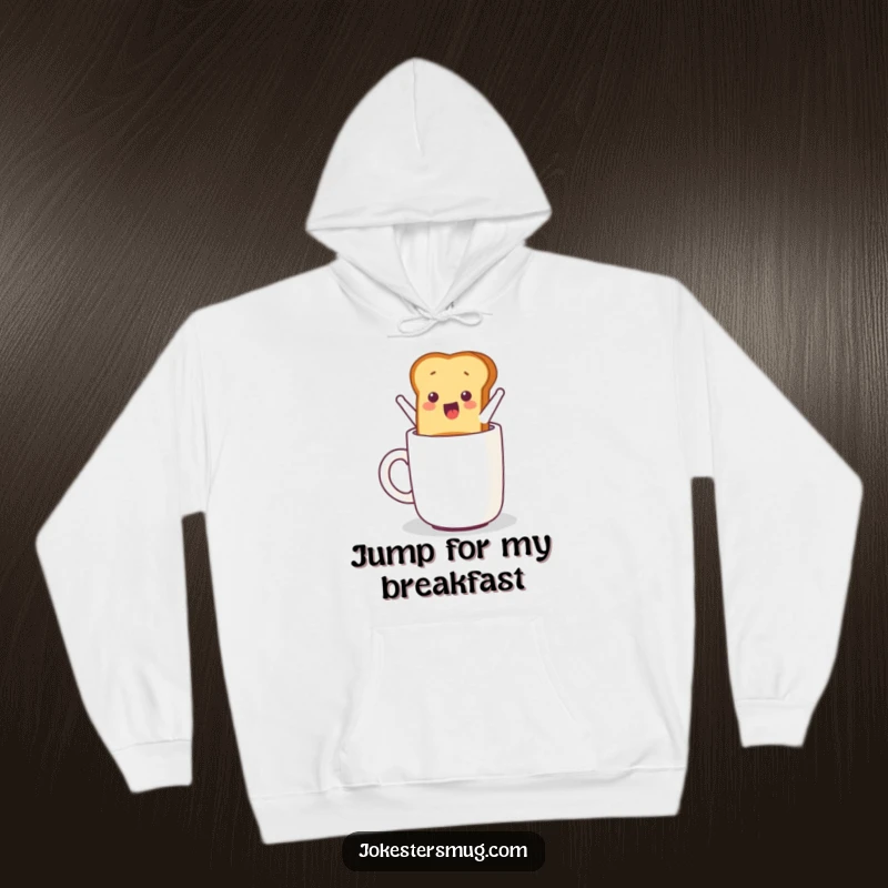 Funny hoodie graphic showing a piece of toast energetically jumping from a toaster into a mug, symbolizing morning excitement.