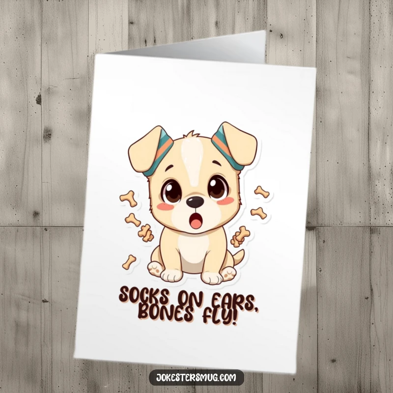 Funny Free Printable Birthday Card: Surprised puppy with socks on ears juggles bones, a downloadable gift for laughs.