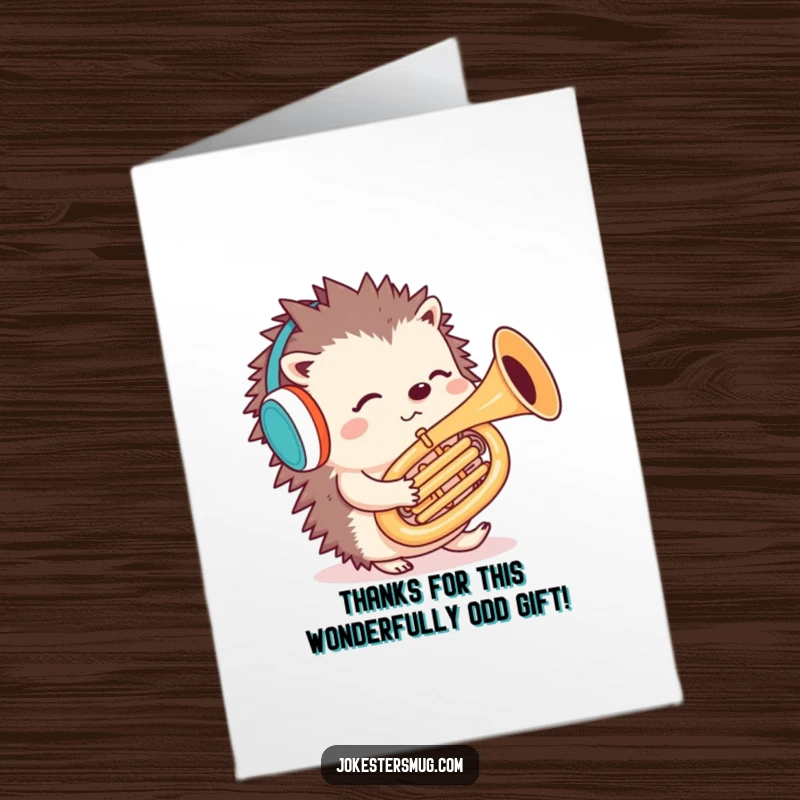 Funny Free Printable Thank You Card: A confused hedgehog wearing earmuffs, humorously playing a tuba backwards.