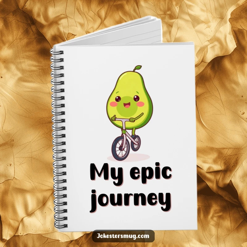 Funny notebook featuring a smiling avocado wobbling on a miniature unicycle, ideal for journaling and notes.