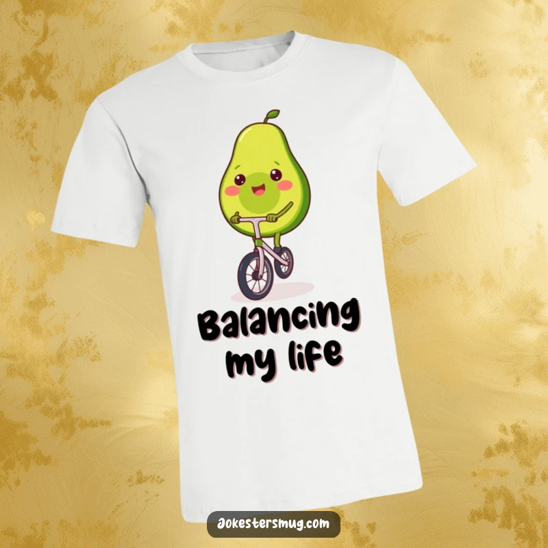 Funny avocado t-shirt featuring a happy avocado attempting to ride a small unicycle, wobbling slightly but smiling widely.