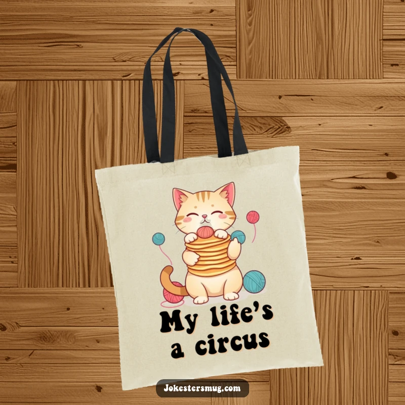 Funny cat tote bag, balancing pancakes on nose, juggling yarn, practical and humorous accessory, excellent funny gift.