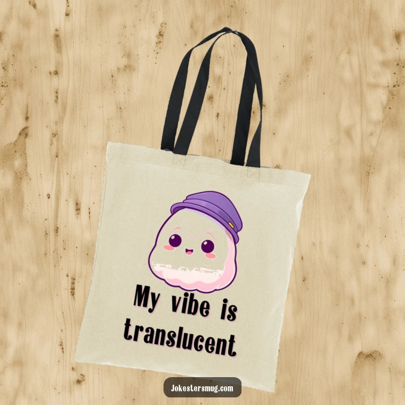 Funny tote bag with a jelly blob character failing to keep a hat on as it phases through, great for errands.