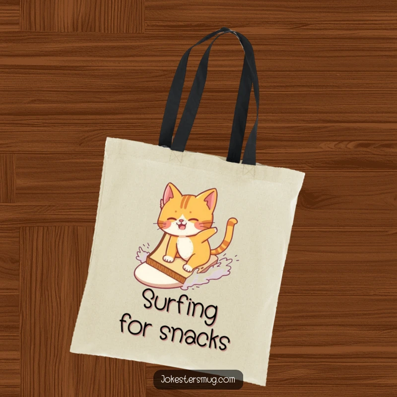 Funny cat wiping out while surfing a giant slice of toast on a tote bag, ideal for carrying essentials with a humorous touch.